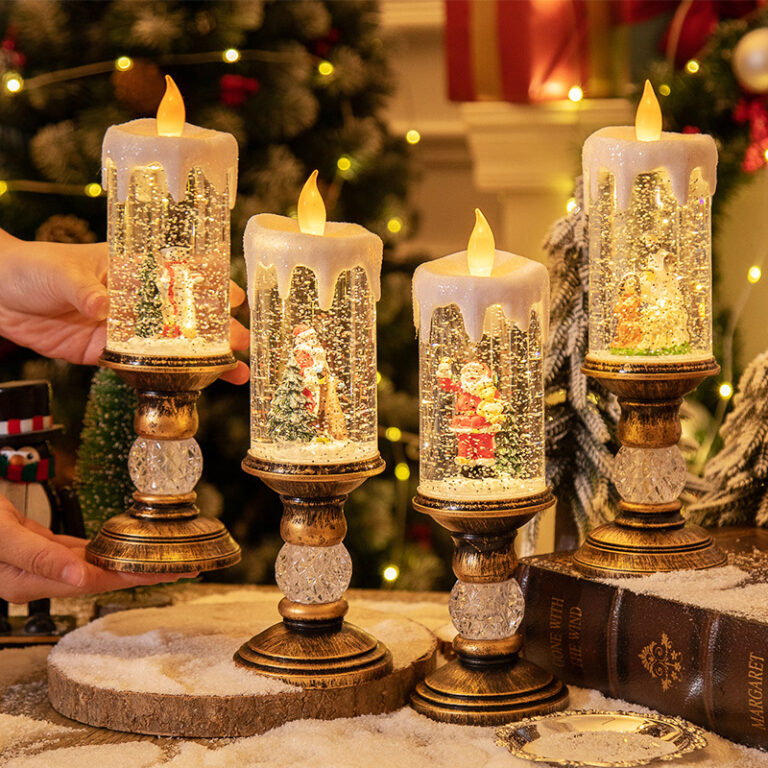 Flameless LED candle lantern holding a lit snow globe winter scene, safe to leave switched on indoors