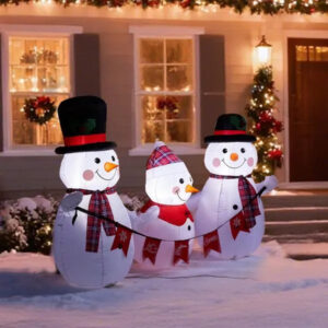 Inflatable snowman family yard decoration lit from within