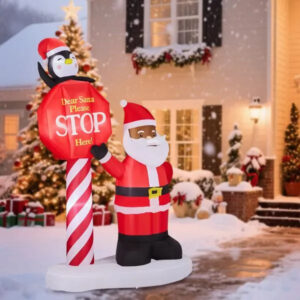 Tall inflatable Black Santa holding a stop sign, lit from within