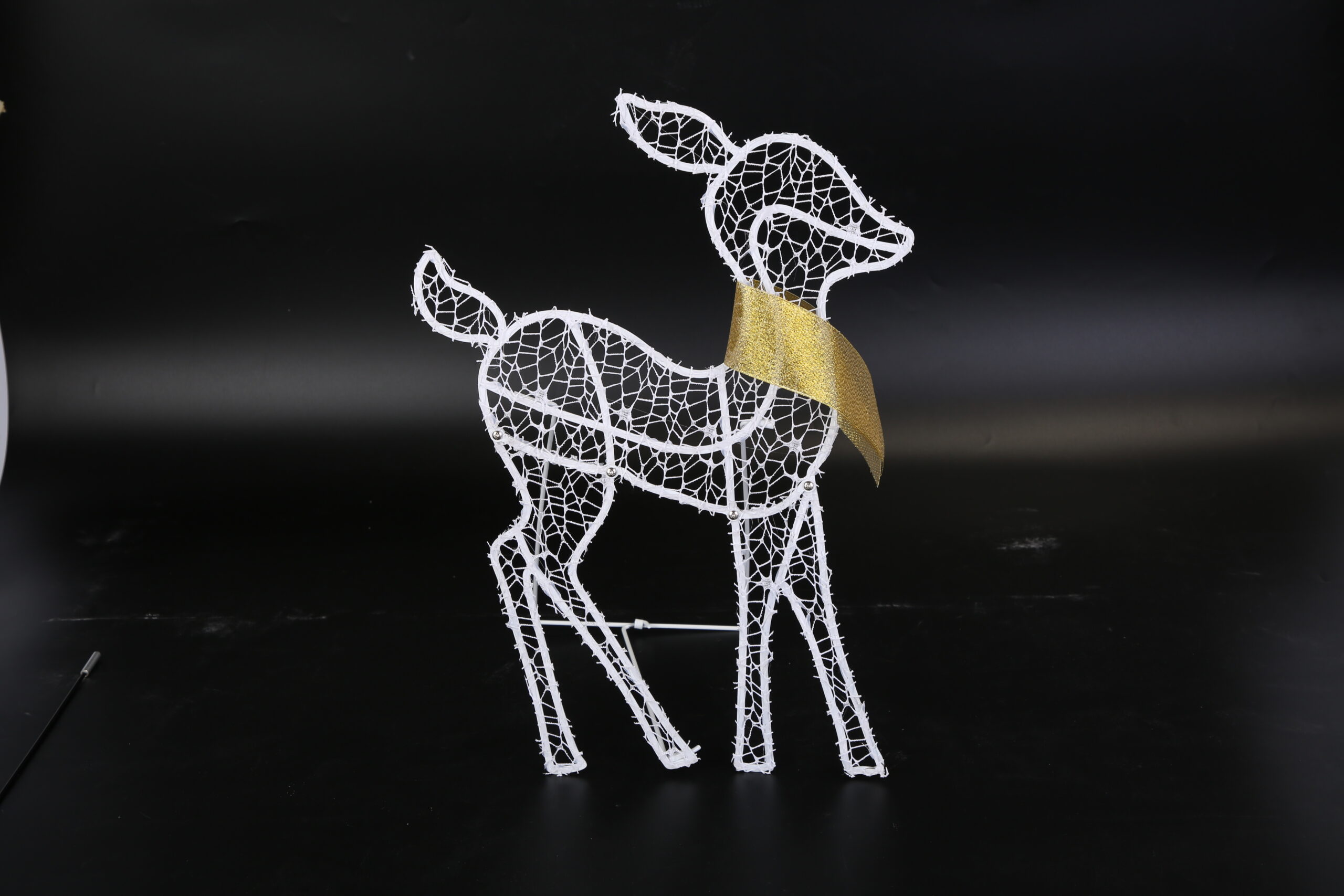 Three lighted reindeer figures forming a family yard display, view 3