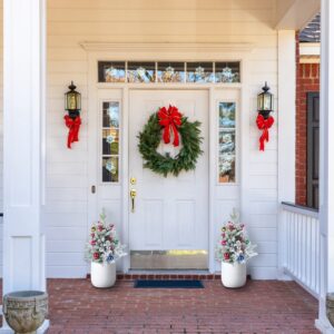 Lighted Christmas urn fillers with berries and ornaments