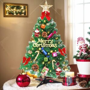 Miniature pre lit Christmas tree decorated with small ornaments