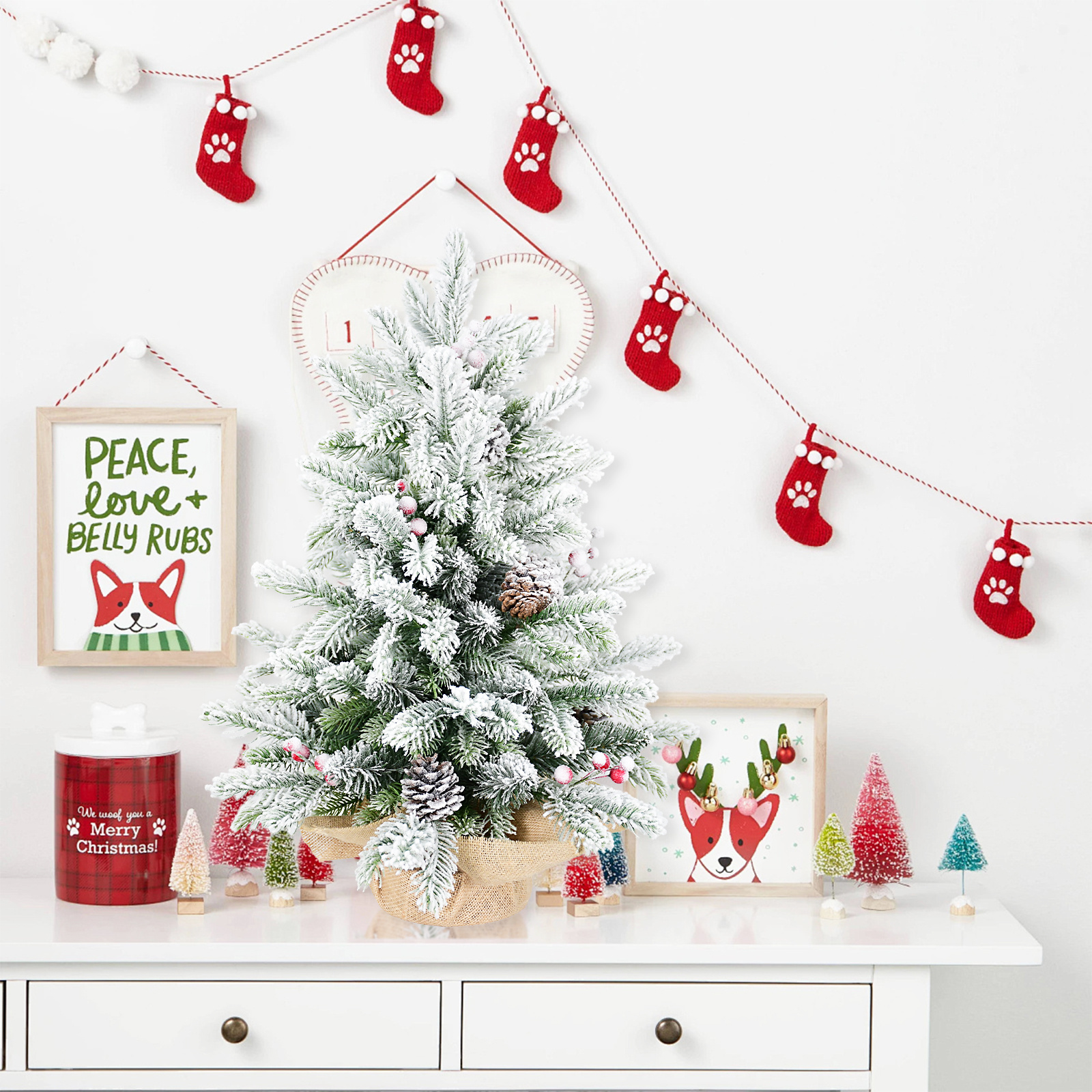 Small snow flocked tabletop Christmas tree with cones and berries, view 2