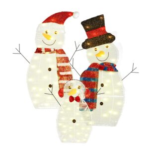 Three lighted snowman figures forming a family yard display
