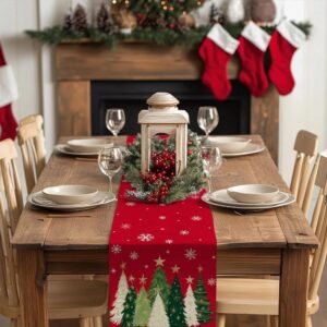 Christmas table runner printed with trees and snowflakes