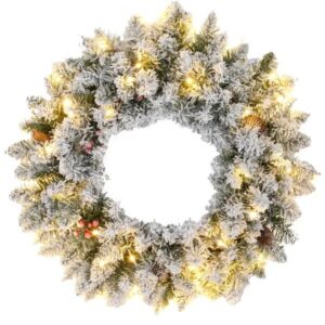 Snow flocked pre lit Christmas wreath with pine cones and red berries