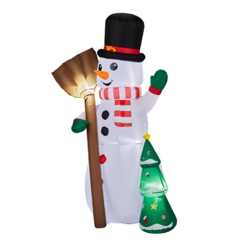 Inflatable snowman holding a broom beside a tree, lit from within, view 2