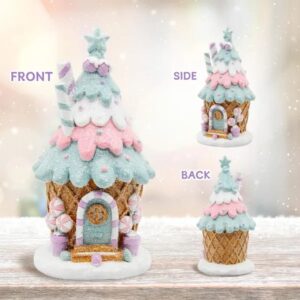 Pastel resin gingerbread house figurine for a tabletop