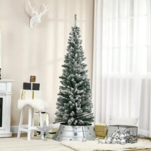 Snow flocked artificial Christmas tree on a steel stand