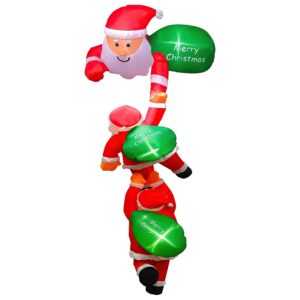 Hanging inflatable with three Santas climbing upwards, lit by LEDs