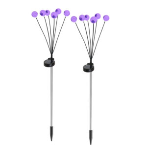 Pair of solar eyeball path lights on ground stakes with purple glowing eyeballs