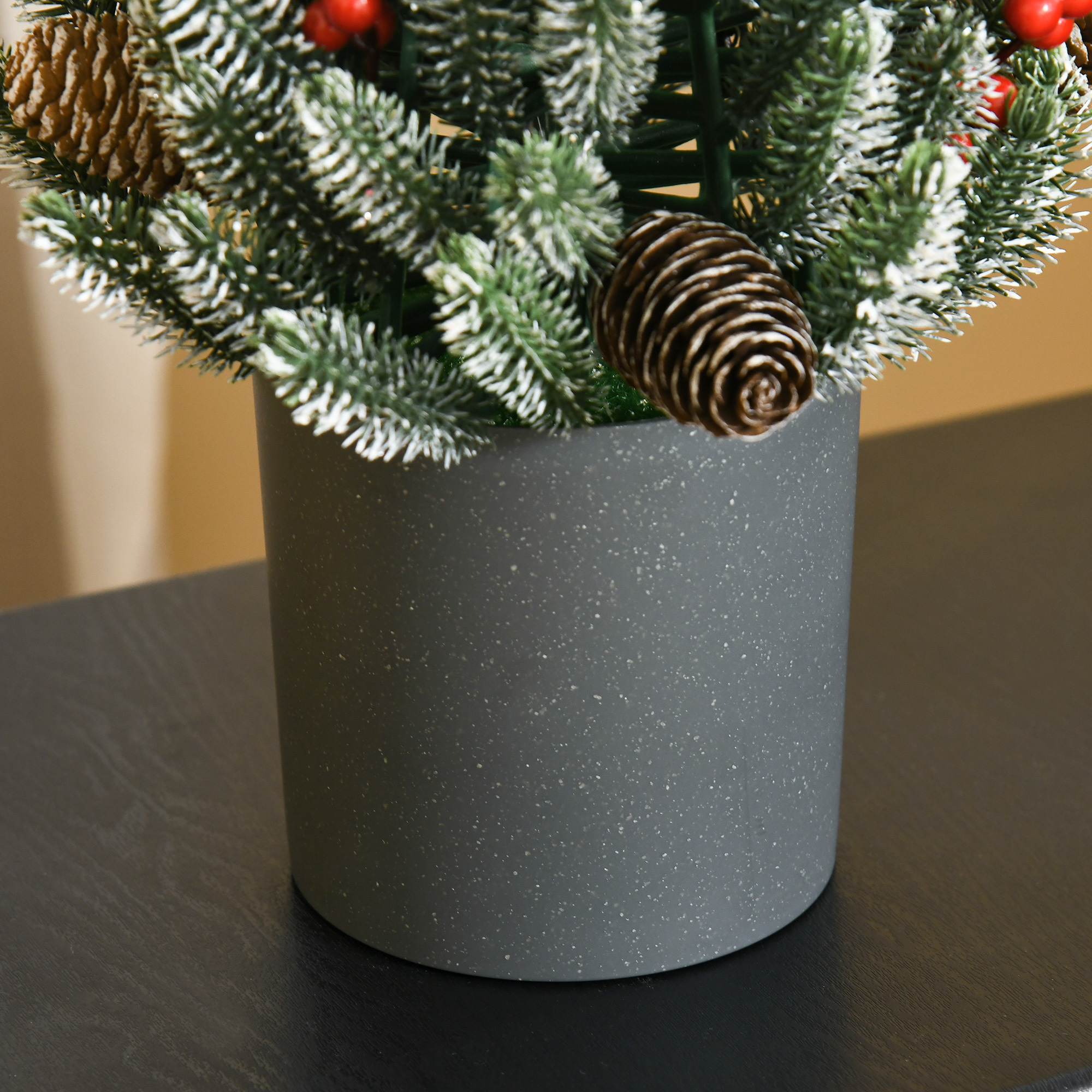 Flocked tabletop Christmas tree trimmed with pine cones and berries, view 4