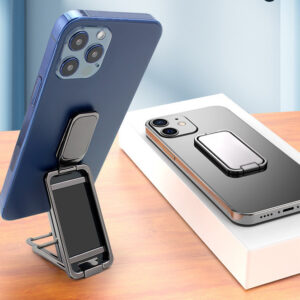 Retractable ring phone holder supporting a phone as a kickstand on a desk