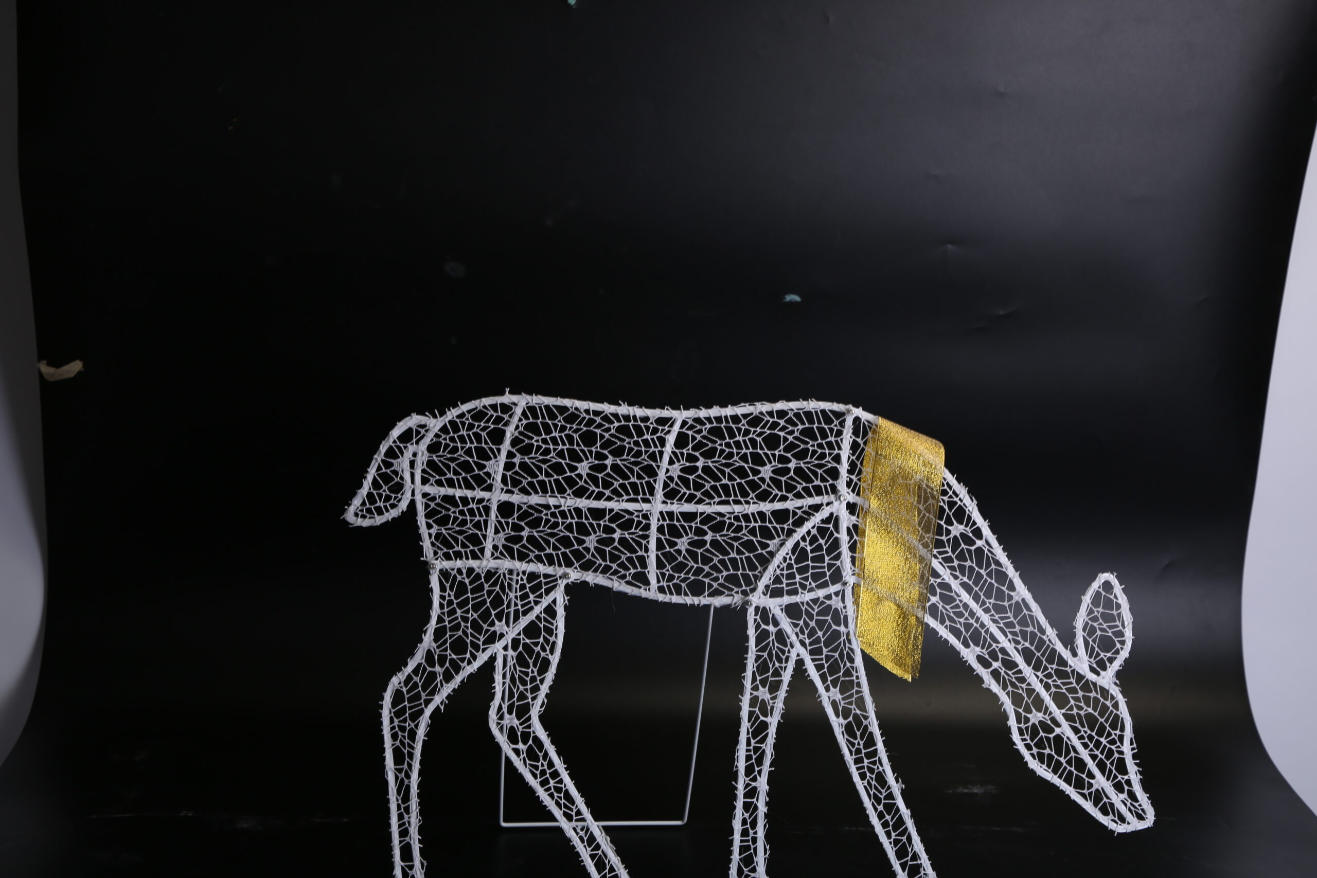 Three lighted reindeer figures forming a family yard display, view 2