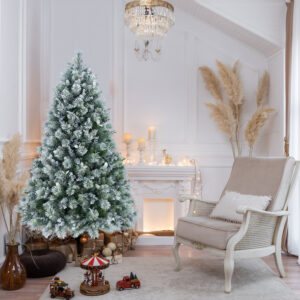 Snow flocked artificial Christmas tree with hard needle tips